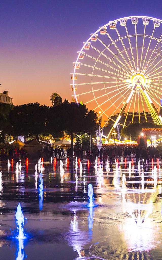 illumination village de noel grande roue miroir d eau