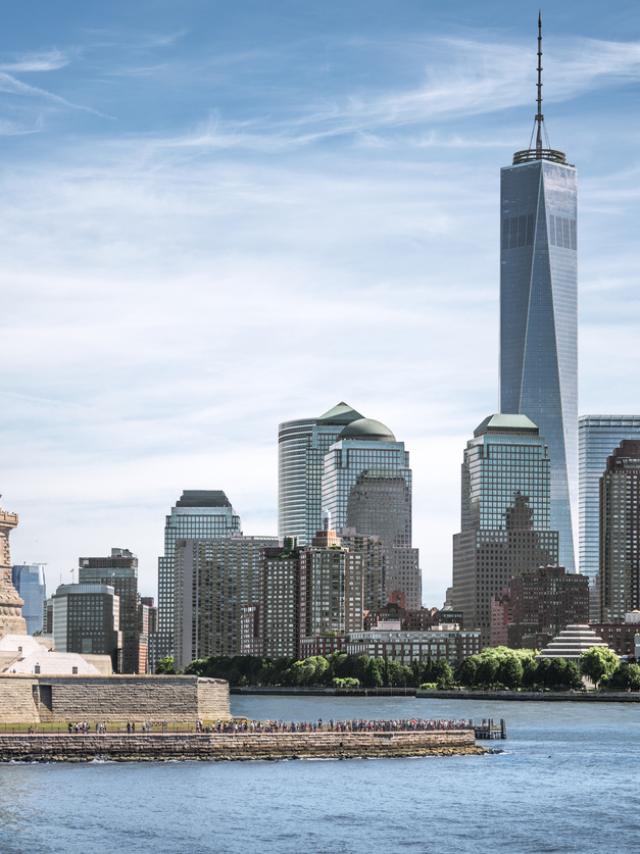 The Statue of Liberty with One World Trade Center background, Landmarks of New York City, USA