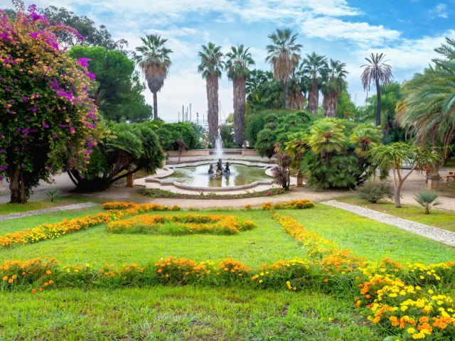 View of floral colorful lawn and fountain in the Alfredo Nobel park in San Remo. Liguria, Italy