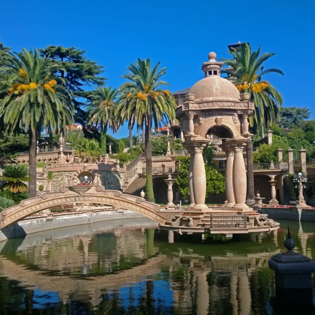 Imperia, Italy - September 12, 2014: the pond and the decorative composition of Villa Grock on sunny weather